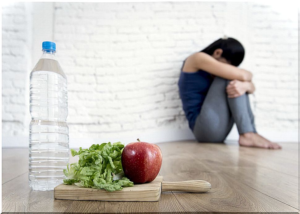 Depressed woman with food and water: factors that influence depression