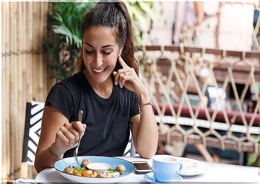 Woman eating slowly.