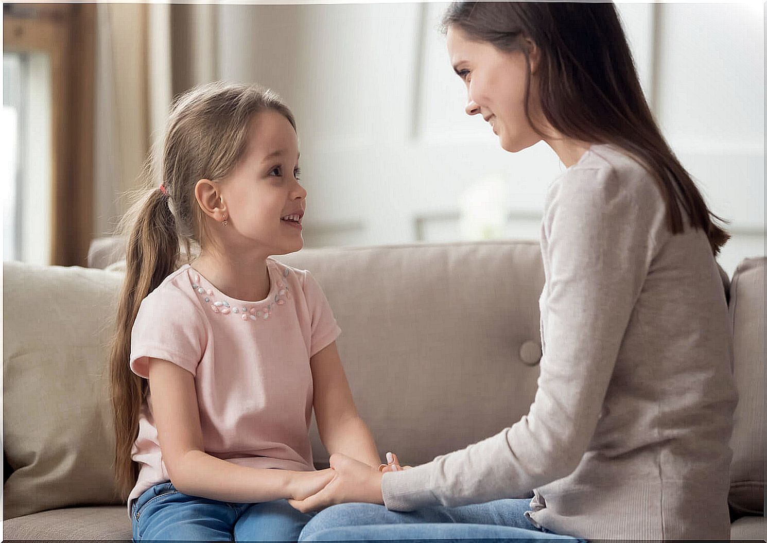 Mother talking to her daughter in a positive way.