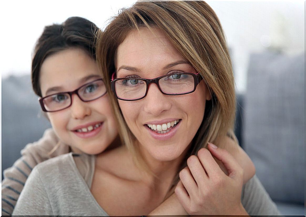 Mother and daughter with glasses.