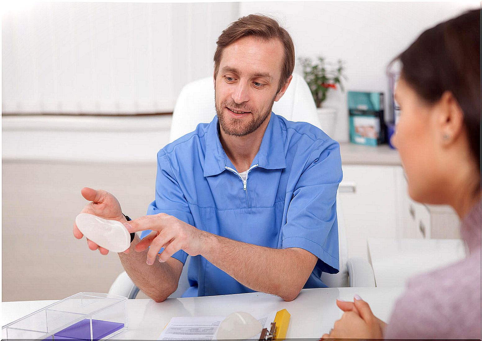 Doctor explaining breast reconstruction.